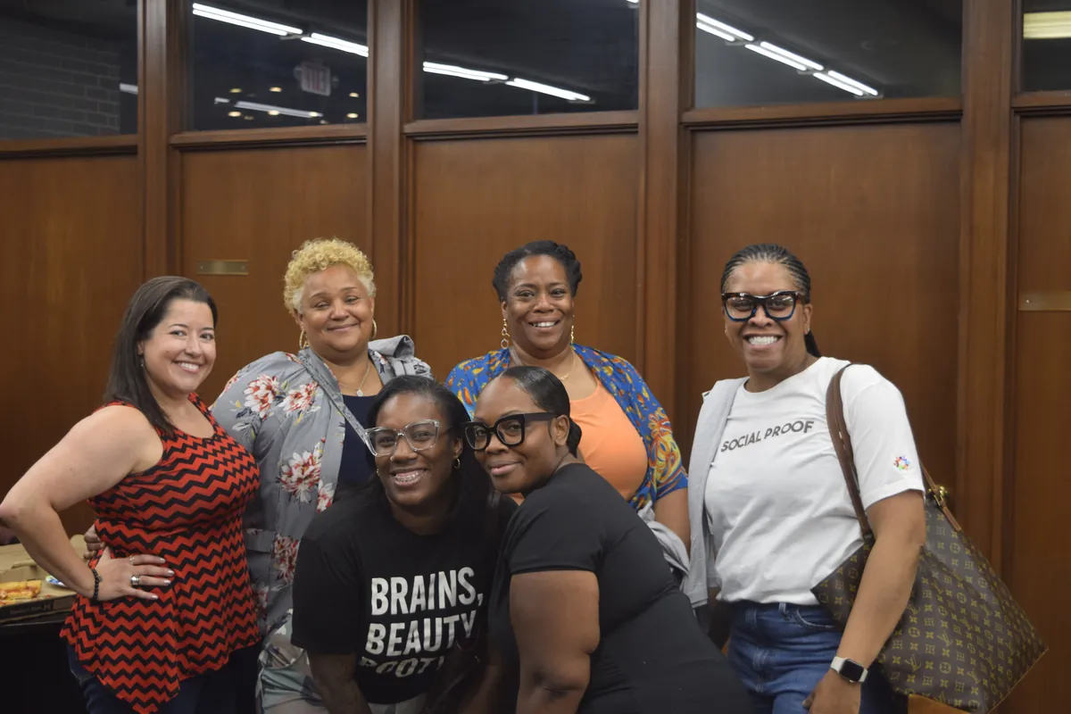 Members posing together at a podcaster meetup